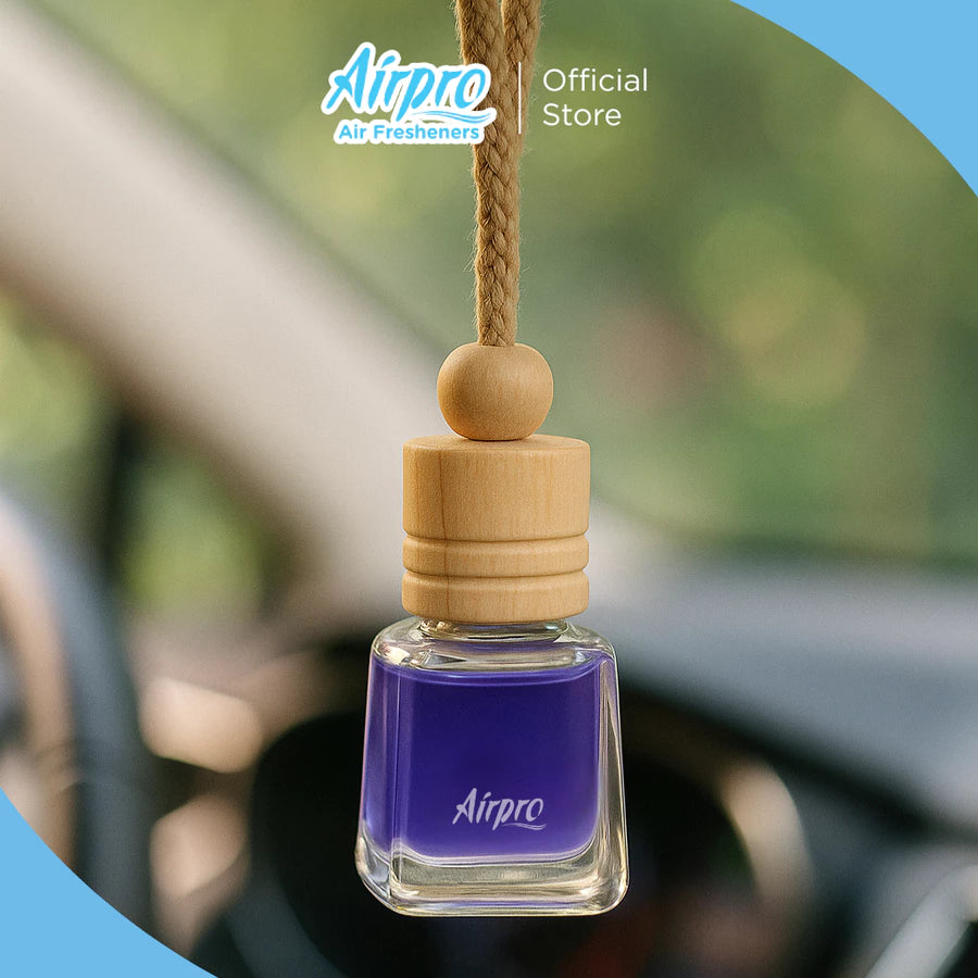 Car air freshener with wooden top hanging inside a car, featuring the Airpro brand.